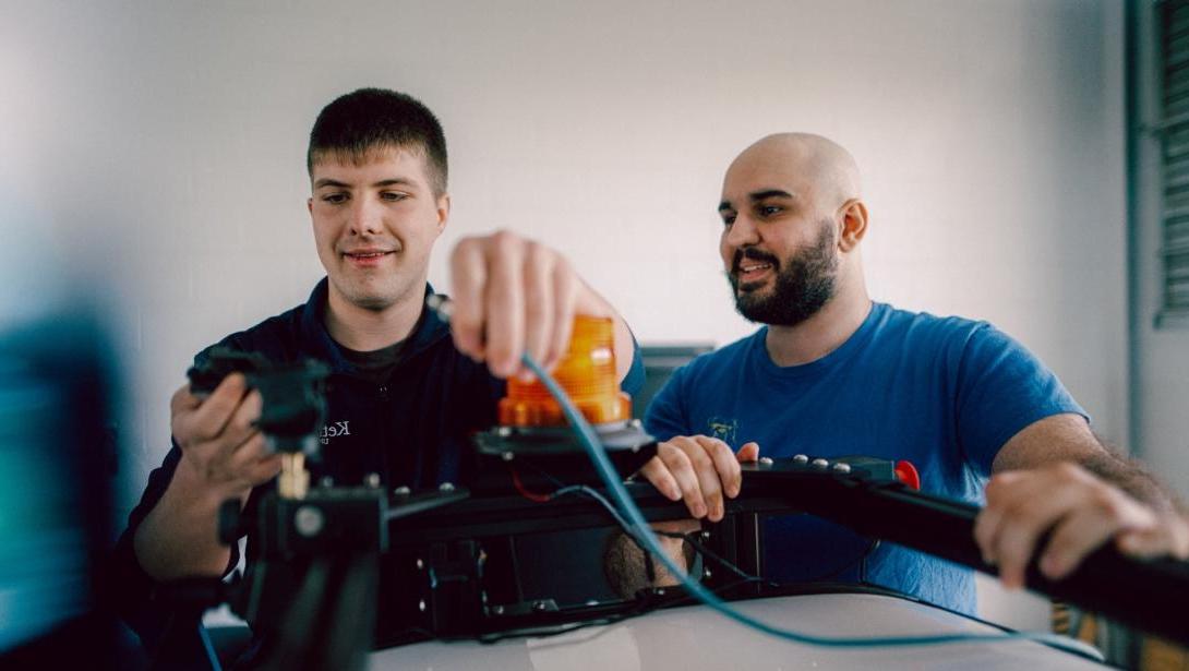 Computer Engineering students working with equipment